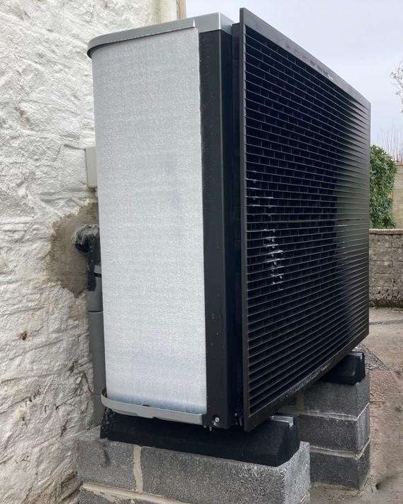 Heat Pump with ground mounted solar panels in Llandeilo, Wales